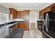 Kitchen features dark countertops, wooden cabinets and stainless steel appliances at 4310 Wellbrook Ct, Douglasville, GA 30135