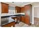 Kitchen featuring wooden cabinets, stainless steel appliances, and granite countertops at 4310 Wellbrook Ct, Douglasville, GA 30135