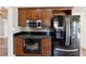Kitchen featuring dark countertops, wooden cabinets and stainless steel appliances at 4310 Wellbrook Ct, Douglasville, GA 30135