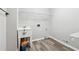 The laundry room is equipped with a utility sink, storage and plenty of open space at 4310 Wellbrook Ct, Douglasville, GA 30135
