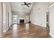 Living room featuring vaulted ceiling, fireplace, and modern ceiling fan at 4310 Wellbrook Ct, Douglasville, GA 30135