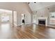 A spacious living room featuring a fireplace and access to other rooms at 4310 Wellbrook Ct, Douglasville, GA 30135