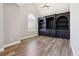 Spacious living room features hardwood floors, built-in shelving, and a bright window at 4310 Wellbrook Ct, Douglasville, GA 30135