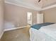 Spacious main bedroom with carpet flooring features ensuite bathroom and closet entrances for convenience at 4310 Wellbrook Ct, Douglasville, GA 30135