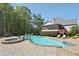 Backyard oasis featuring a sparkling pool, hot tub, and ample lounge space for outdoor enjoyment at 4310 Wellbrook Ct, Douglasville, GA 30135