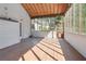 Inviting screened-in porch features wood flooring and ceiling, perfect for relaxing outdoors at 4310 Wellbrook Ct, Douglasville, GA 30135