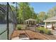 View of a tennis court next to a pool and shaded gazebo area, offering a relaxing outdoor recreation space at 4310 Wellbrook Ct, Douglasville, GA 30135