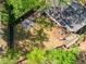 Aerial view of backyard featuring a deck, manicured lawn, and fire pit area, perfect for outdoor enjoyment at 1226 Haven Brook Ne Way, Brookhaven, GA 30319