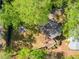 Aerial view of backyard featuring a deck, manicured lawn, and fire pit area, great for entertaining guests at 1226 Haven Brook Ne Way, Brookhaven, GA 30319