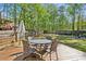 Backyard featuring a wooden deck with outdoor table and chairs at 1226 Haven Brook Ne Way, Brookhaven, GA 30319