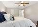 Bedroom with white bedding and ceiling fan at 1226 Haven Brook Ne Way, Brookhaven, GA 30319