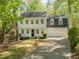 Traditional two-story home with a well-manicured lawn and a two-car garage in a neighborhood setting at 1226 Haven Brook Ne Way, Brookhaven, GA 30319