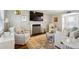 Bright living room boasts a fireplace, plush seating, stylish decor, and natural light at 1226 Haven Brook Ne Way, Brookhaven, GA 30319