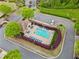Aerial view of the community pool with clear blue water, lounge chairs and landscaped surroundings at 1902 Glen Ivy, Marietta, GA 30062