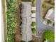 Aerial view of townhomes nestled among mature trees and landscaping, highlighting the community's layout and green spaces at 1902 Glen Ivy, Marietta, GA 30062