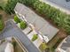 Aerial view of townhomes featuring neat landscaping, private driveways, and convenient access to a nearby highway at 1902 Glen Ivy, Marietta, GA 30062