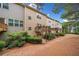 View of the townhome backyard featuring a multi-level wooden deck, complemented by lush landscaping and a private outdoor space at 1902 Glen Ivy, Marietta, GA 30062