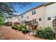Exterior backyard view of townhomes featuring multi-level wooden decks, complemented by lush landscaping and private outdoor spaces at 1902 Glen Ivy, Marietta, GA 30062