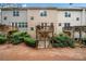 Townhome backyard features multi-level wooden decks, complemented by lush landscaping and a private outdoor space at 1902 Glen Ivy, Marietta, GA 30062