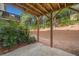 Exterior of the backyard under a deck featuring a patio and green bushes great for relaxing and enjoying outdoor activities at 1902 Glen Ivy, Marietta, GA 30062