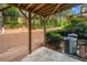 Backyard under a wooden deck with patio and air conditioning units, surrounded by lush greenery and natural landscape at 1902 Glen Ivy, Marietta, GA 30062