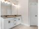 Bathroom featuring white cabinets, granite countertop, modern fixtures, and a tile floor for a clean aesthetic at 1902 Glen Ivy, Marietta, GA 30062