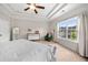 Bright bedroom with a tray ceiling, neutral paint, large window, and stylish furniture, perfect for relaxation at 1902 Glen Ivy, Marietta, GA 30062