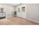 Versatile carpeted bonus room with french doors, adjacent to a bathroom, offering flexibility for various uses at 1902 Glen Ivy, Marietta, GA 30062