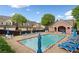 A refreshing community pool with lounge chairs, umbrellas, and a covered pavilion at 1902 Glen Ivy, Marietta, GA 30062