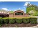 A welcoming brick community sign, Glen Ivy, amidst green landscaping and blue sky backdrop at 1902 Glen Ivy, Marietta, GA 30062