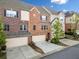 Attractive townhomes with brick exteriors and attached garages in a residential setting at 1902 Glen Ivy, Marietta, GA 30062