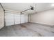 Spacious two-car garage featuring an automatic door and clean concrete floor, providing secure parking and storage at 1902 Glen Ivy, Marietta, GA 30062
