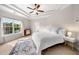 A primary bedroom featuring a tray ceiling, large window, and a patterned rug at 1902 Glen Ivy, Marietta, GA 30062