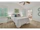 Bedroom with an ensuite bathroom featuring neutral walls and carpeted floors at 5245 Cherry Hill Ln, Powder Springs, GA 30127