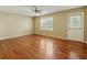 Bedroom featuring hard wood floor, neutral walls, ceiling fan, a back door and one window at 5245 Cherry Hill Ln, Powder Springs, GA 30127