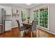 Breakfast nook with windows overlooking backyard and hardwood floors at 5245 Cherry Hill Ln, Powder Springs, GA 30127