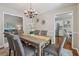 Dining room adjacent to the living room and kitchen, with seating for six at 5245 Cherry Hill Ln, Powder Springs, GA 30127