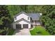 Charming two-story home with a two car garage and a quaint front porch at 5245 Cherry Hill Ln, Powder Springs, GA 30127