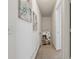 Hallway featuring carpeted floor and view of a living room with a fireplace at 5245 Cherry Hill Ln, Powder Springs, GA 30127