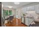Eat-in kitchen includes stainless appliances, granite countertops, and hardwood floors at 5245 Cherry Hill Ln, Powder Springs, GA 30127