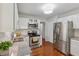 Well-lit kitchen with stainless steel appliances and granite counters at 5245 Cherry Hill Ln, Powder Springs, GA 30127