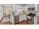 Modern kitchen with stainless steel appliances, granite countertops, and ample cabinetry at 5245 Cherry Hill Ln, Powder Springs, GA 30127