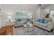 Bright living room offering hardwood floors, natural light, and stylish decor at 5245 Cherry Hill Ln, Powder Springs, GA 30127