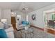 Inviting living room featuring hardwood floors, neutral tones, and a modern ceiling fan at 5245 Cherry Hill Ln, Powder Springs, GA 30127