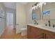 Beautiful bathroom with double sink vanity, wood cabinets, and modern fixtures, and toilet at 553 Somersby Dr, Dallas, GA 30157