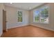 Bedroom with hardwood floors and large windows with neighborhood views at 553 Somersby Dr, Dallas, GA 30157
