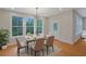Dining room with a view, set table, and modern chandelier is ideal for entertaining guests at 553 Somersby Dr, Dallas, GA 30157
