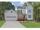 Charming new construction, two-story home with attached garage and inviting front porch at 553 Somersby Dr, Dallas, GA 30157