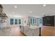 Open concept kitchen with stainless appliances, a large island, and easy access to the living room at 553 Somersby Dr, Dallas, GA 30157
