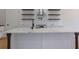 Close-up of kitchen island featuring a marbled countertop and designer faucet at 553 Somersby Dr, Dallas, GA 30157